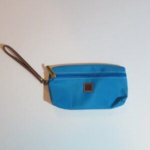 Blue clutch with zippered close and brown handle